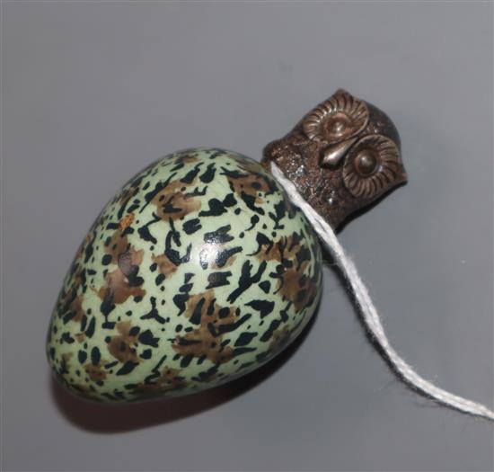 A Victorian novelty ceramic scent flask in the form of an egg with screw-on white metal top modelled as an owl, L 6.5cm